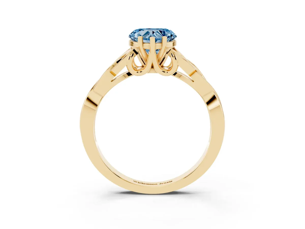 Fancy Blue Heart Cut Diamond Solitaire Engagement Ring with Celtic Knot Band and Four-Prong Setting Yellow gold