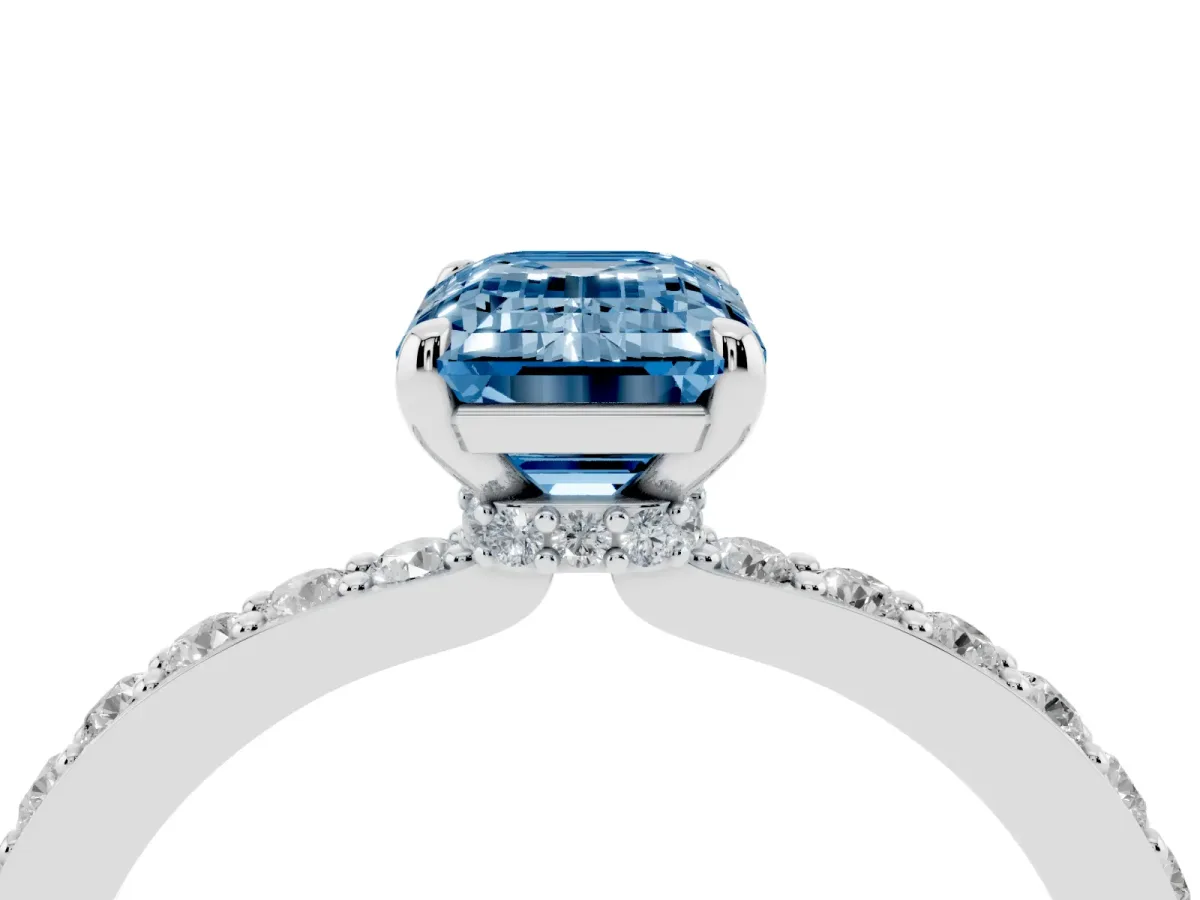 Fancy Blue Emerald Cut Diamond Solitaire Engagement Ring with Pavé Band and Four-Prong Setting Silver