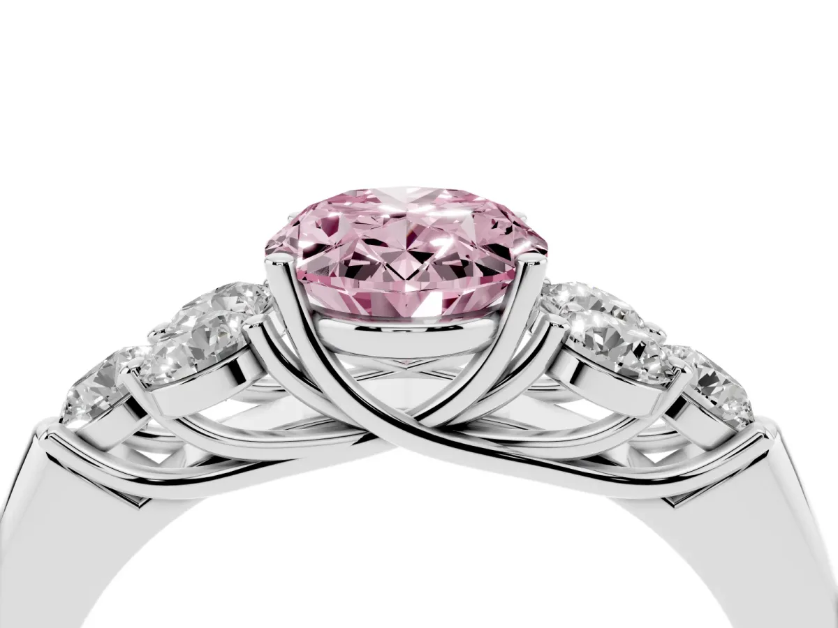 Fancy Pink Oval Cut Cut Diamond Cluster Ring with Round Accent Stones and Prong Setting on a Classic Band Platinum