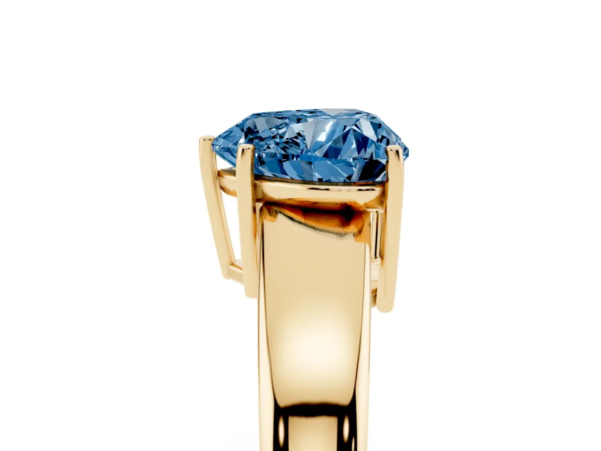 Fancy Blue Heart Cut Solitaire Diamond Ring with Tapered Band and Four-Prong Setting Yellow gold