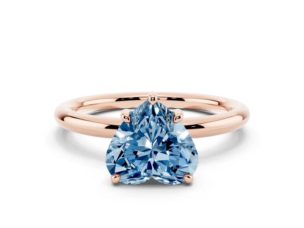 Fancy Blue Heart Cut Solitaire Diamond Ring with Four-Prong Setting on a Plain Band Rose gold