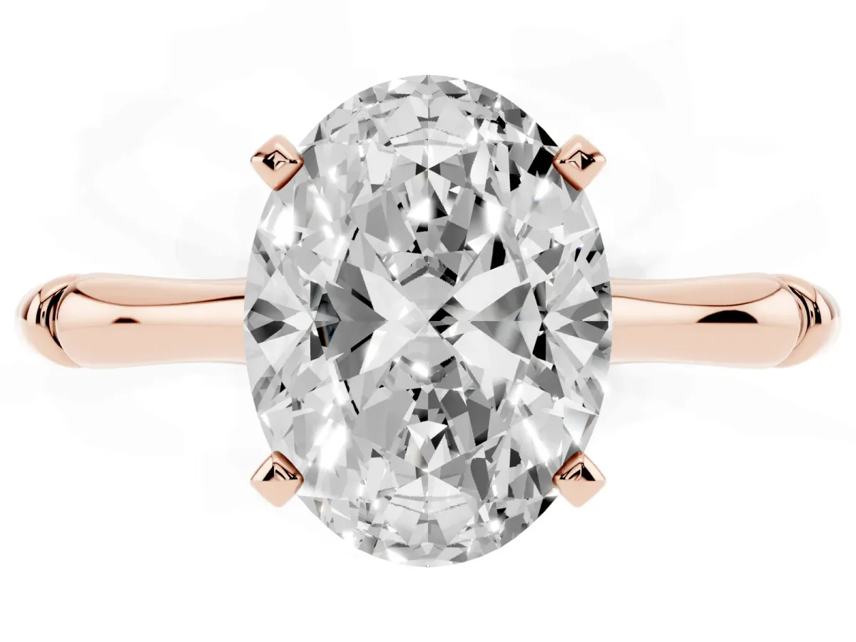 Oval Cut Solitaire Diamond Ring with Bamboo Band and Four-Prong Setting Rose gold
