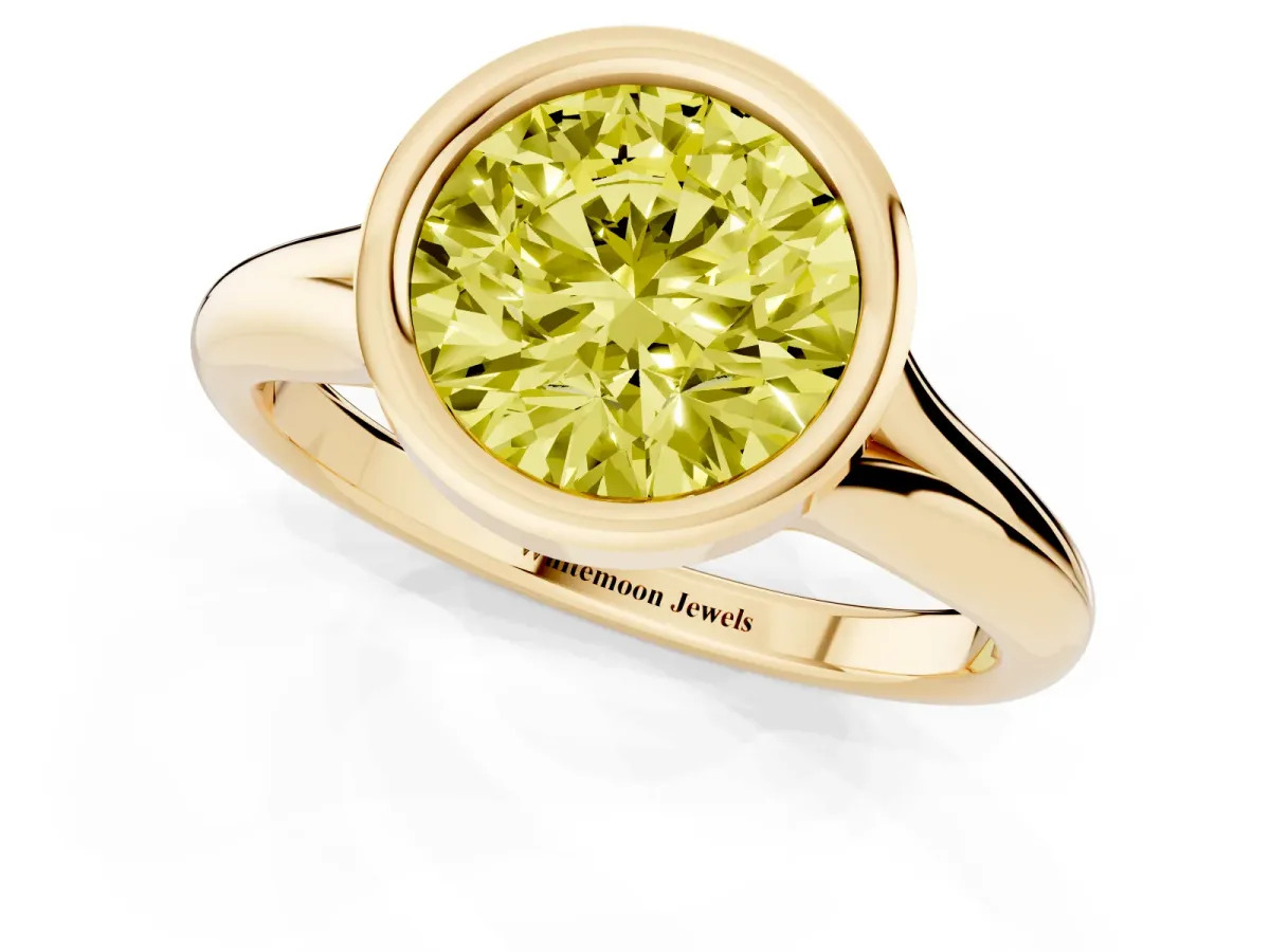 Fancy Yellow Bezel Set Round Cut Solitaire Diamond Ring with Smooth Band Yellow gold