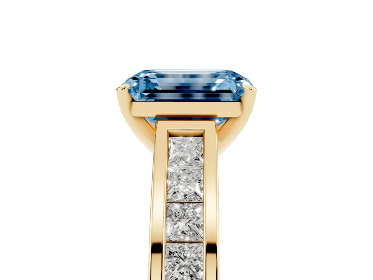 Fancy Blue Emerald Cut Solitaire Diamond Ring with Channel-Set Band and Four-Prong Setting Yellow gold