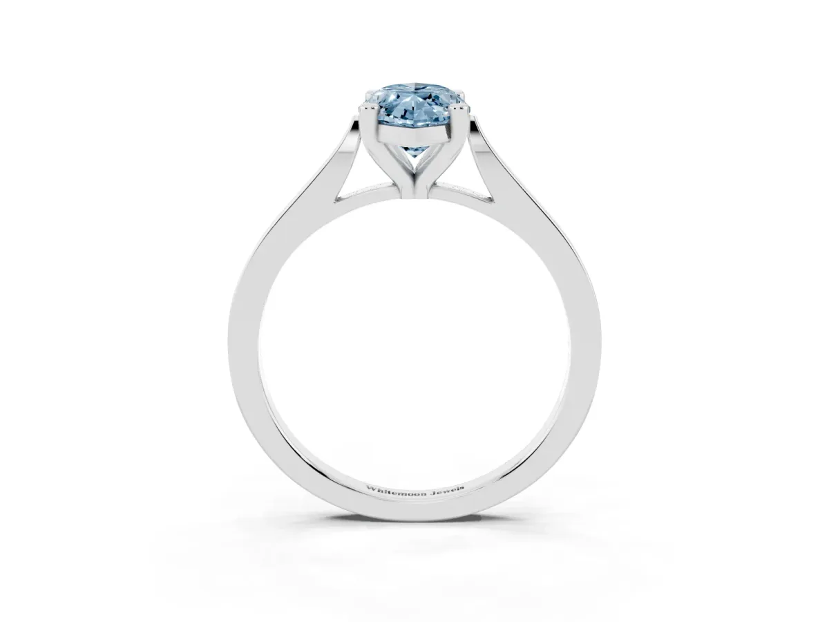 Fancy Blue Marquise Cut Solitaire Diamond Ring with Four-Prong Setting and Tapered Band Platinum