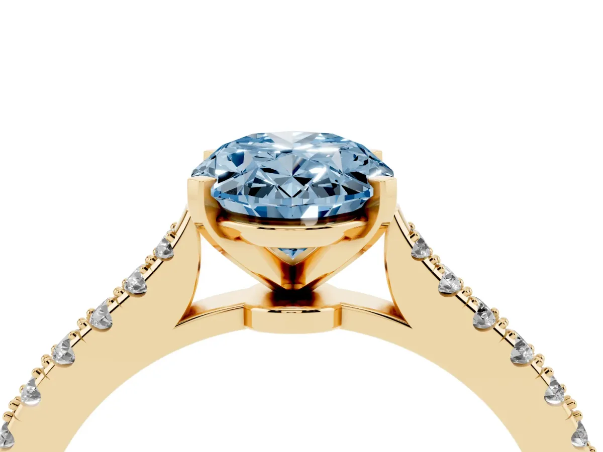 Fancy Blue Oval Cut Cut Solitaire Diamond Engagement Ring with Pave Band and Four-Prong Setting Yellow gold