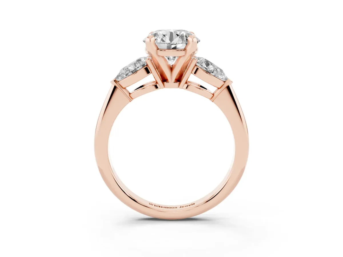 Three-Stone Round Cut Diamond Ring with Pear Side Stones and Four-Prong Setting Rose gold