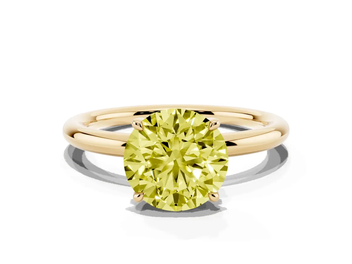 Fancy Yellow Round Cut Diamond Solitaire Ring with Thin Band and Four-Prong Setting Yellow gold