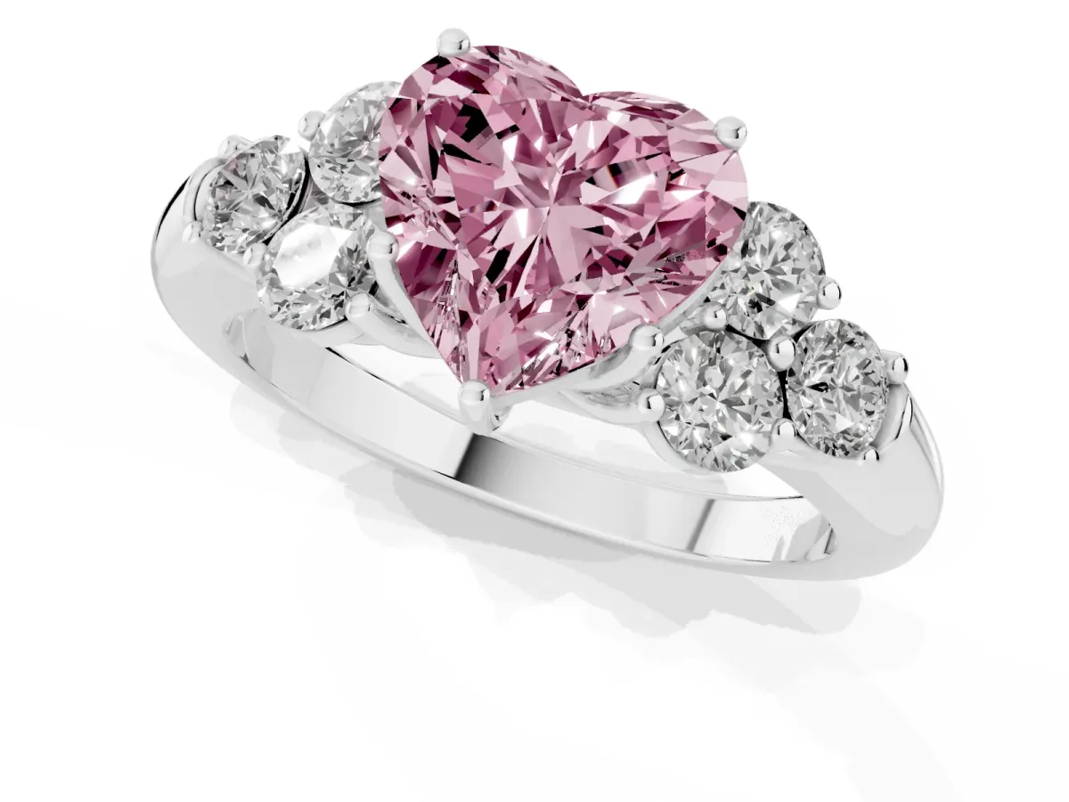 Fancy Pink Heart Cut Cut Diamond Cluster Ring with Round Accent Stones and Prong Setting on a Classic Band White gold