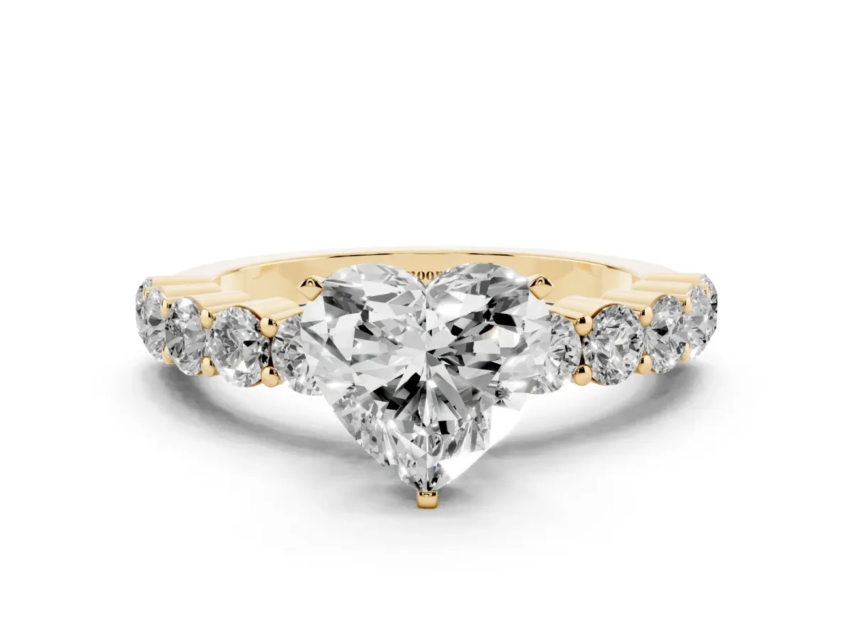 Heart Cut Diamond Solitaire Ring with Shared Prong Round Side Stones Yellow gold