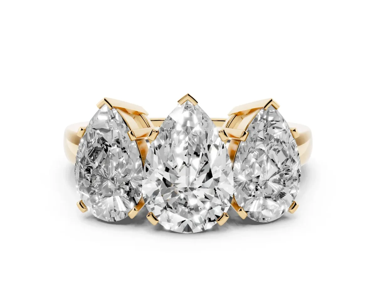 Three-Stone Pear Cut Cut Diamond Ring with Channel Set Band and Four-Prong Setting Yellow gold