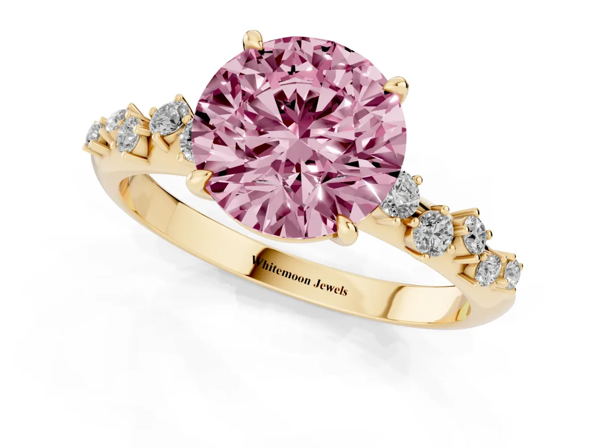 Fancy Pink Round Cut Diamond Cluster Side Stone Solitaire Ring with Prong Setting Yellow gold
