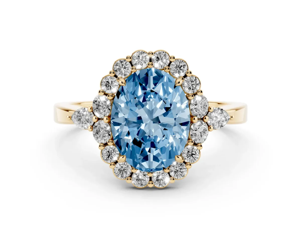 Fancy Blue Oval Cut Diamond Halo Ring with Pear Side Stones and Prong Setting Yellow gold