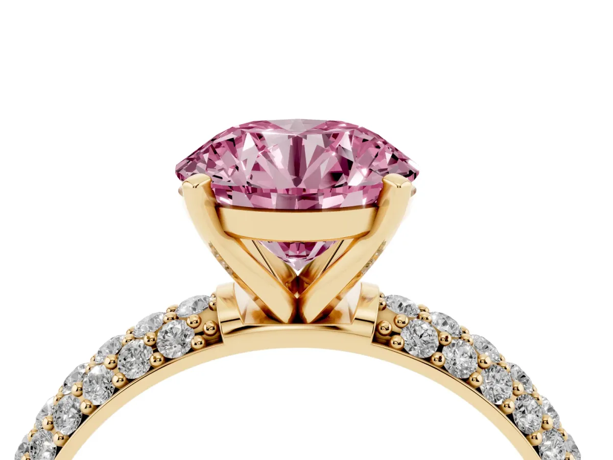 Fancy Pink Round Cut Diamond Solitaire Ring with Prong Setting and Pavé Band Yellow gold