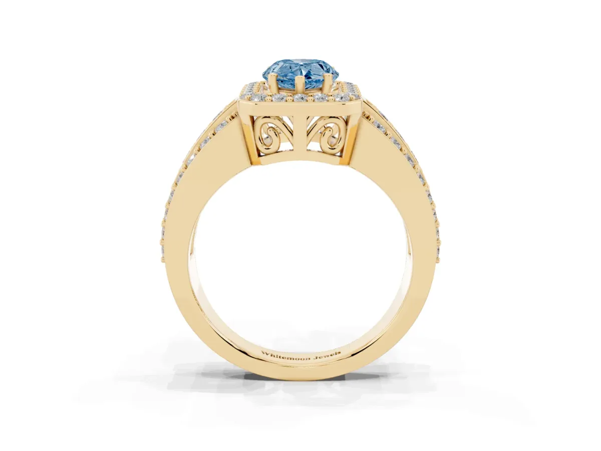 Fancy Blue Pear Cut Halo Diamond Ring with Round Split Shank and Prong Setting Yellow gold