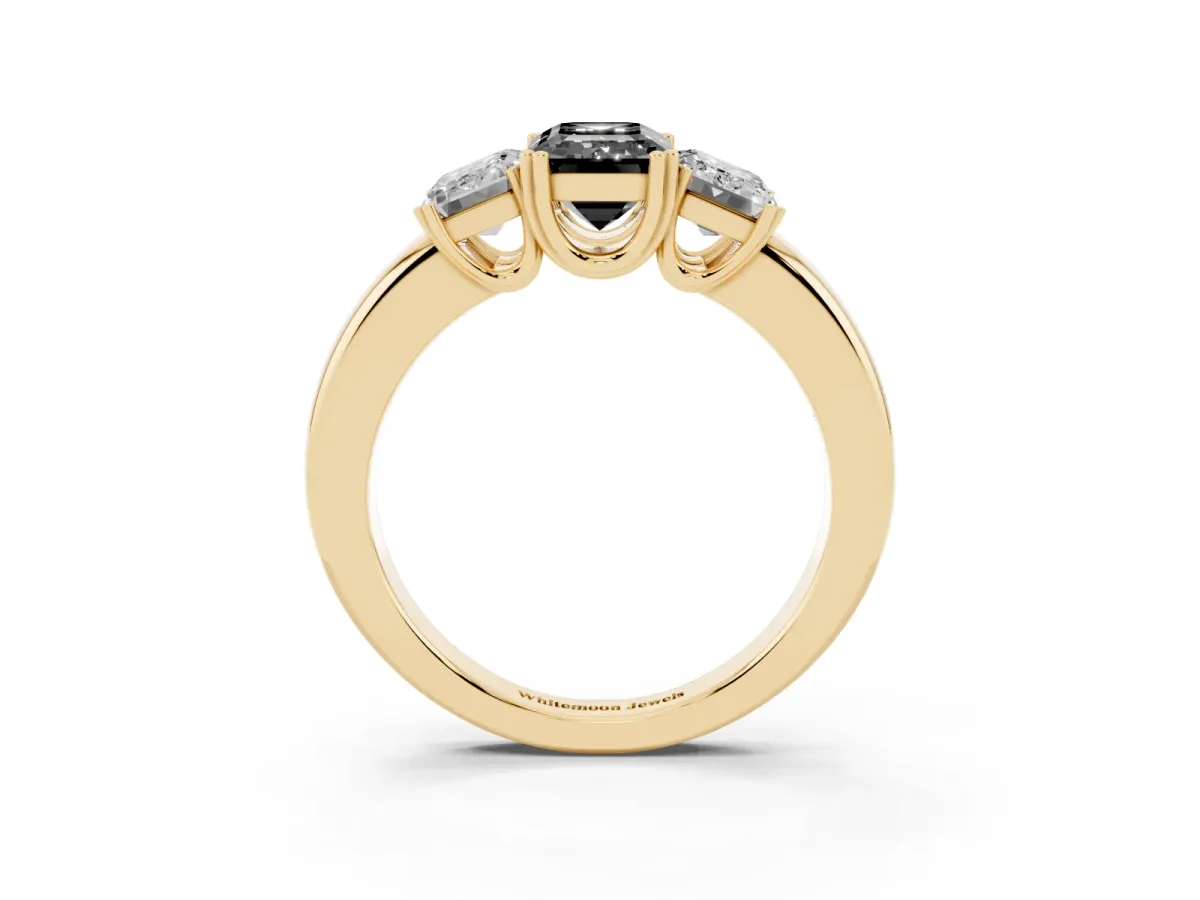 Fancy Black Three-Stone Emerald Cut Cut Diamond Ring with Channel Set Band and Four-Prong Setting Yellow gold