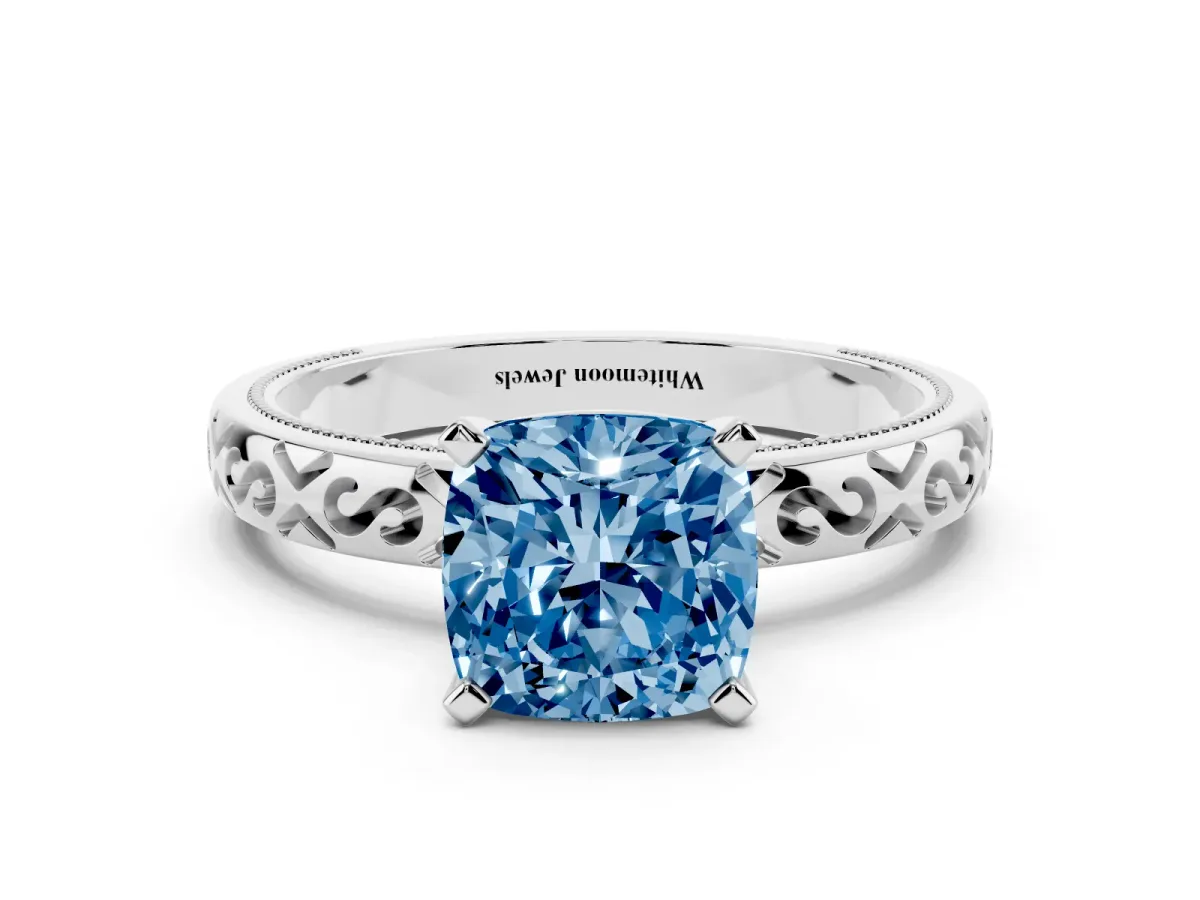 Fancy Blue Cushion Cut Solitaire Engagement Ring with Scrollwork Band and Four-Prong Setting Silver