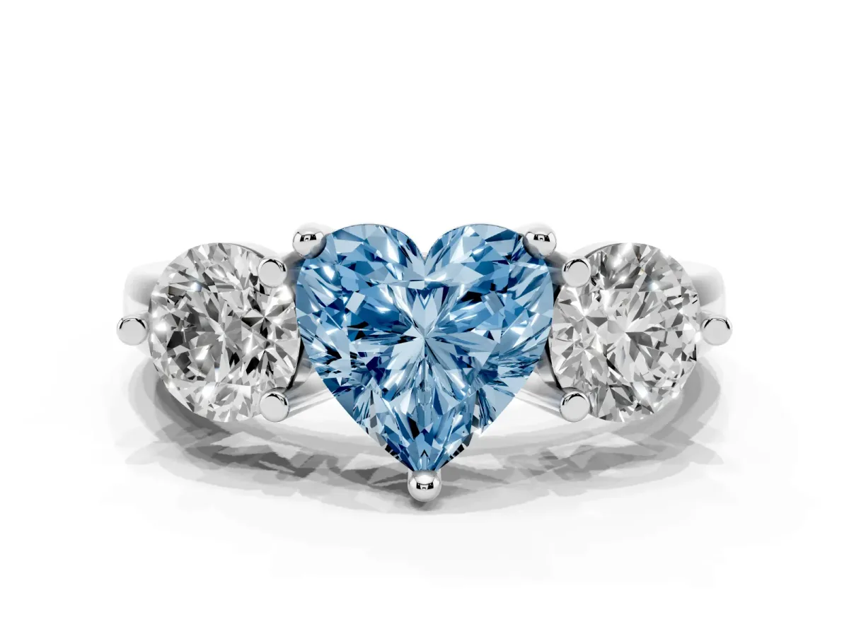 Fancy Blue Three-Stone Heart Cut Brilliant Cut Solitaire Ring with Prong Setting on a Classic Band Silver
