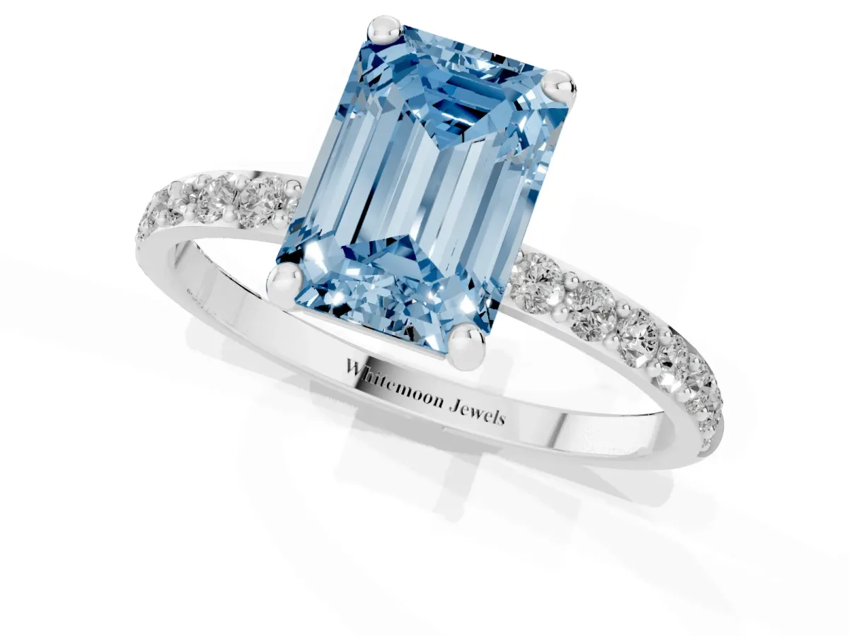 Fancy Blue Emerald Cut Diamond Solitaire Ring with Round Pavé Band and Prong Setting Silver