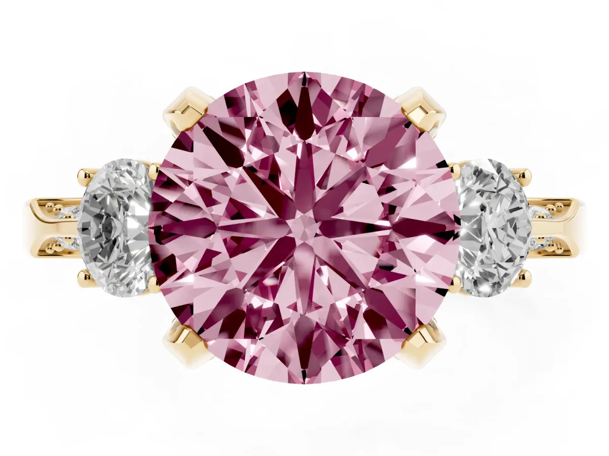 Fancy Pink Round Cut Brilliant Three-Stone Diamond Ring with Pavé Band and Four-Prong Setting Yellow gold