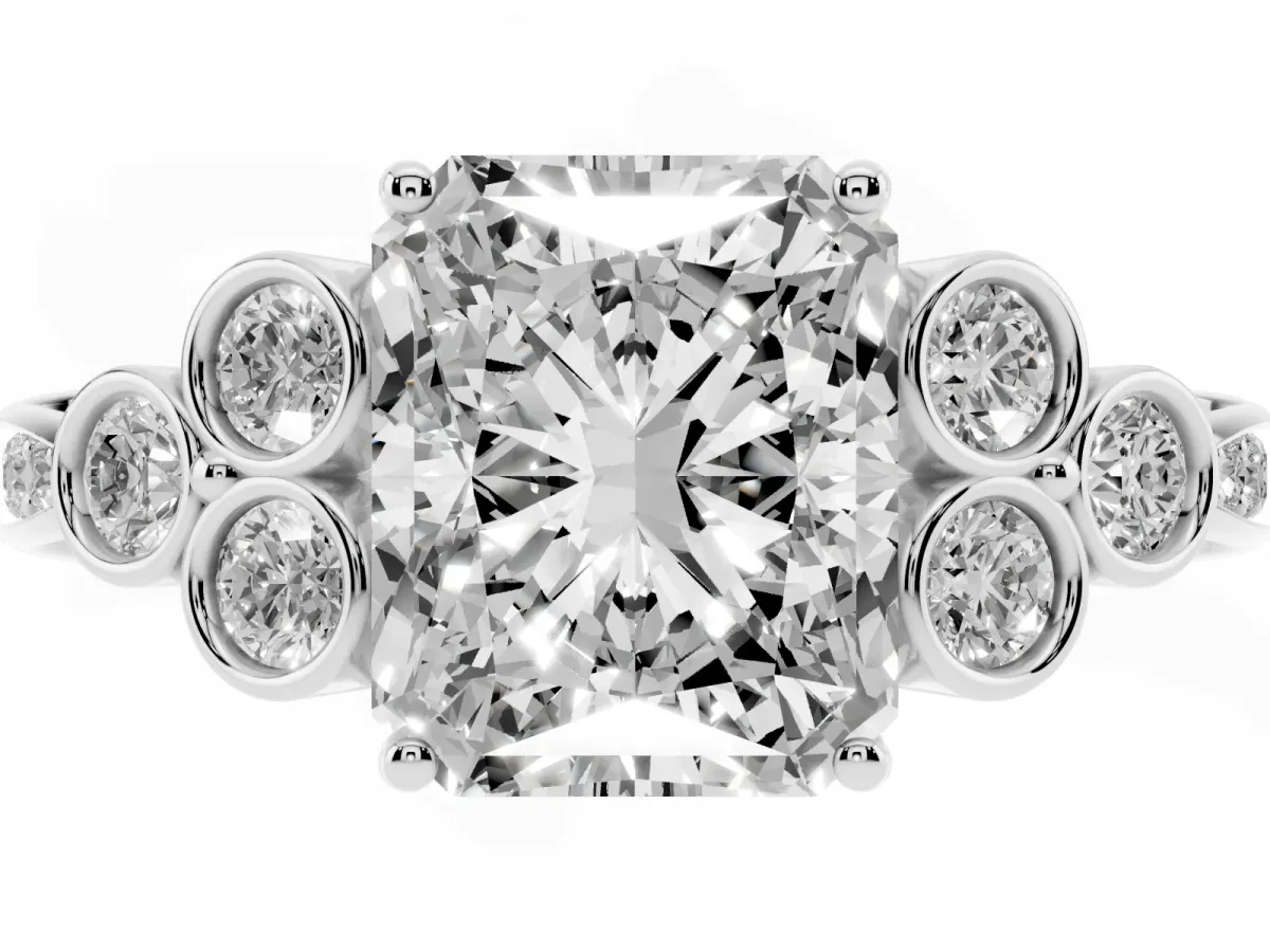 Radiant Cut Cut Diamond Engagement Ring with Bezel Set Round Side Stones and Prong Setting Silver
