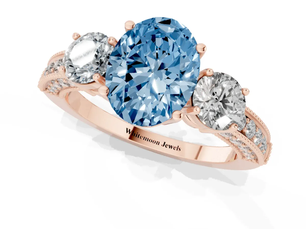 Fancy Blue Oval Cut Three-Stone Diamond Ring with Pavé Band and Four-Prong Setting Rose gold