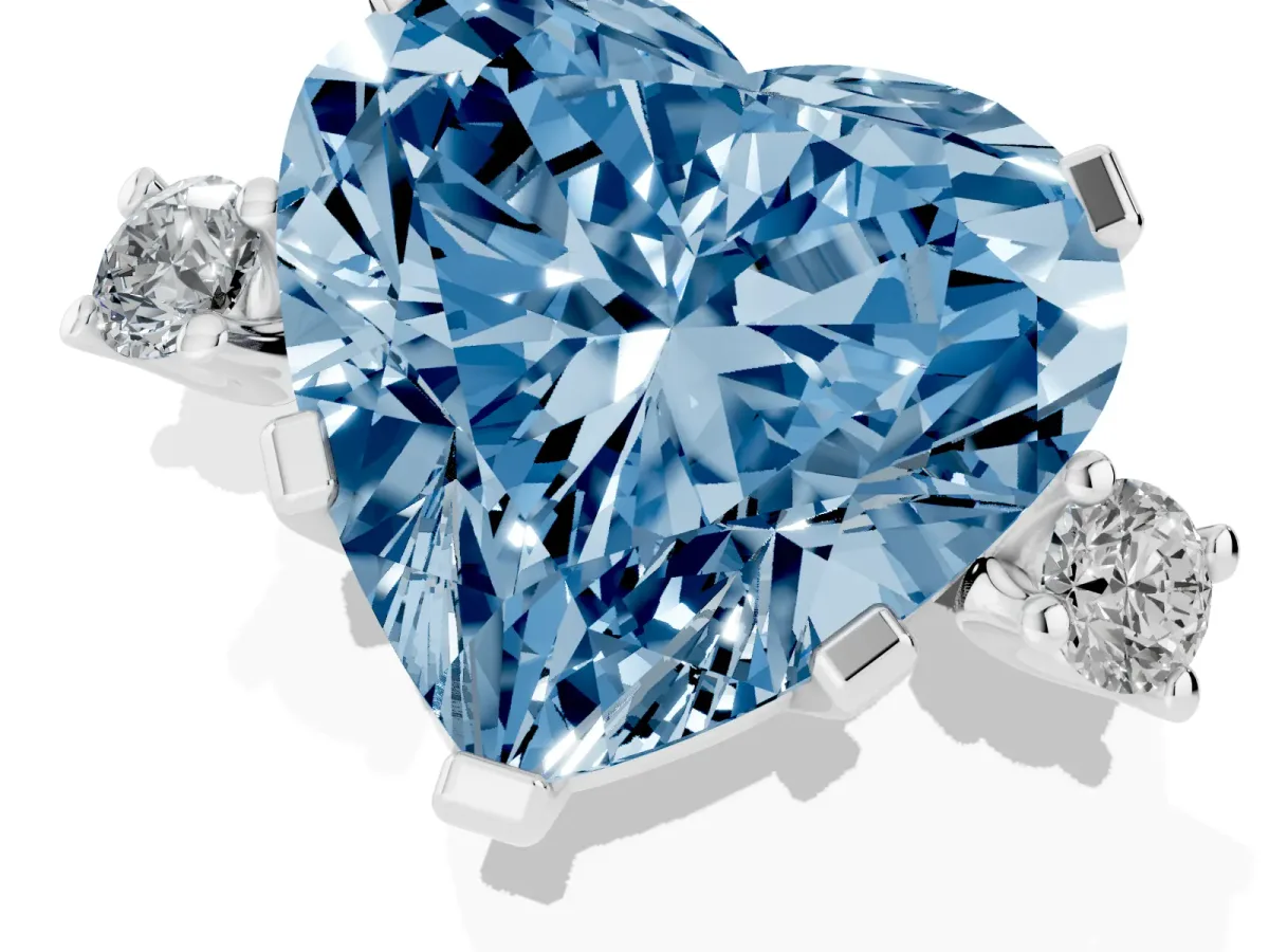 Fancy Blue Heart Cut Cut Three-Stone Solitaire Ring with Round Accent Diamonds and Four-Prong Setting Silver