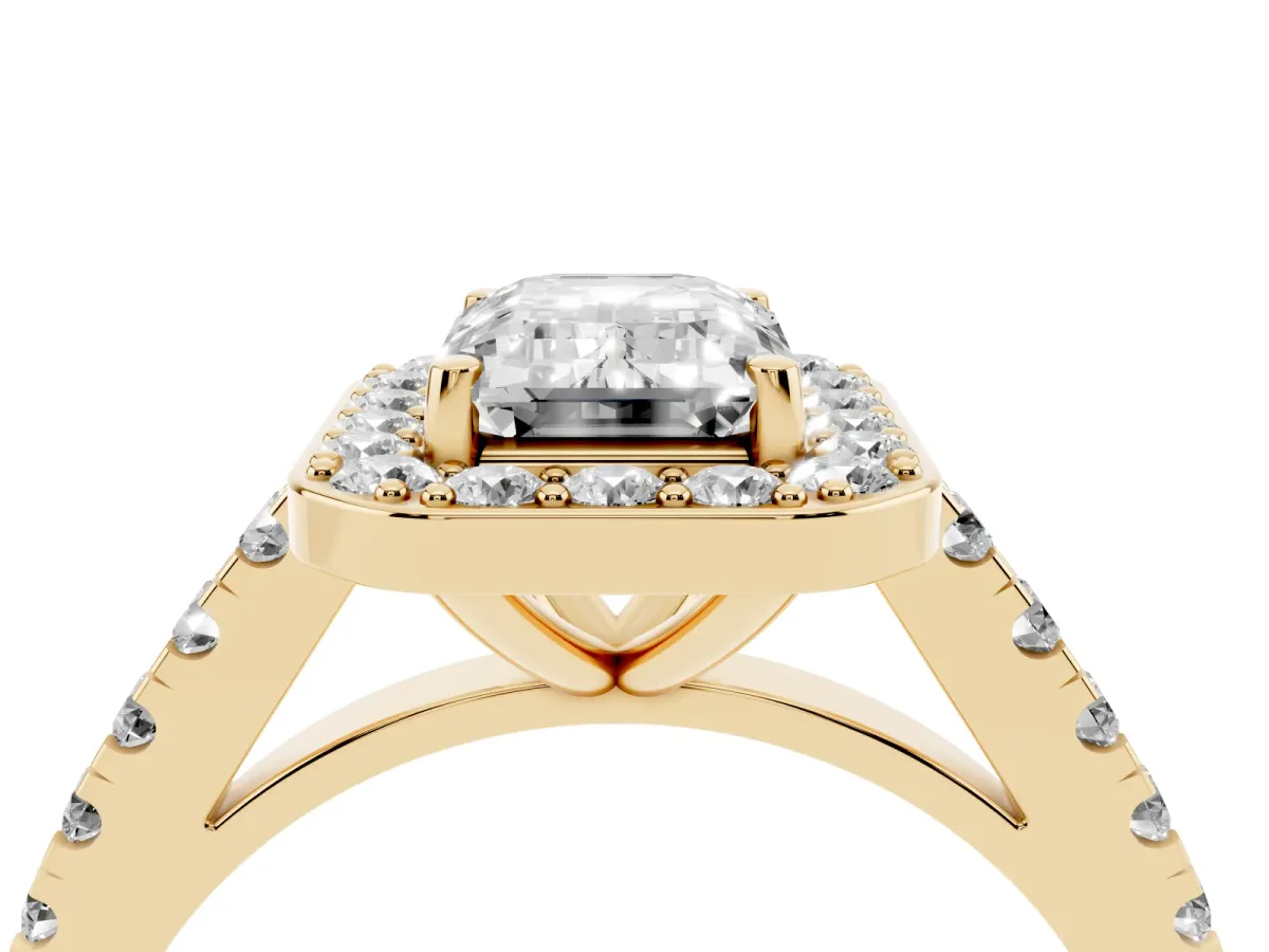 Emerald Cut Diamond Halo Ring with Round Pavé Split Shank and Prong Setting Yellow gold