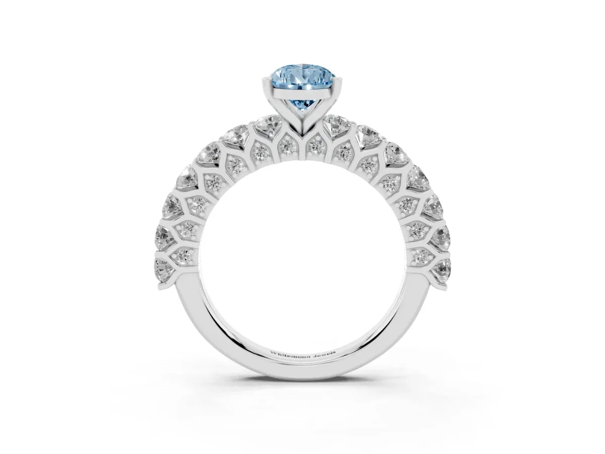 Fancy Blue Pear Cut Diamond Solitaire Ring with Shared Prong Pavé Band and Four-Prong Setting Silver