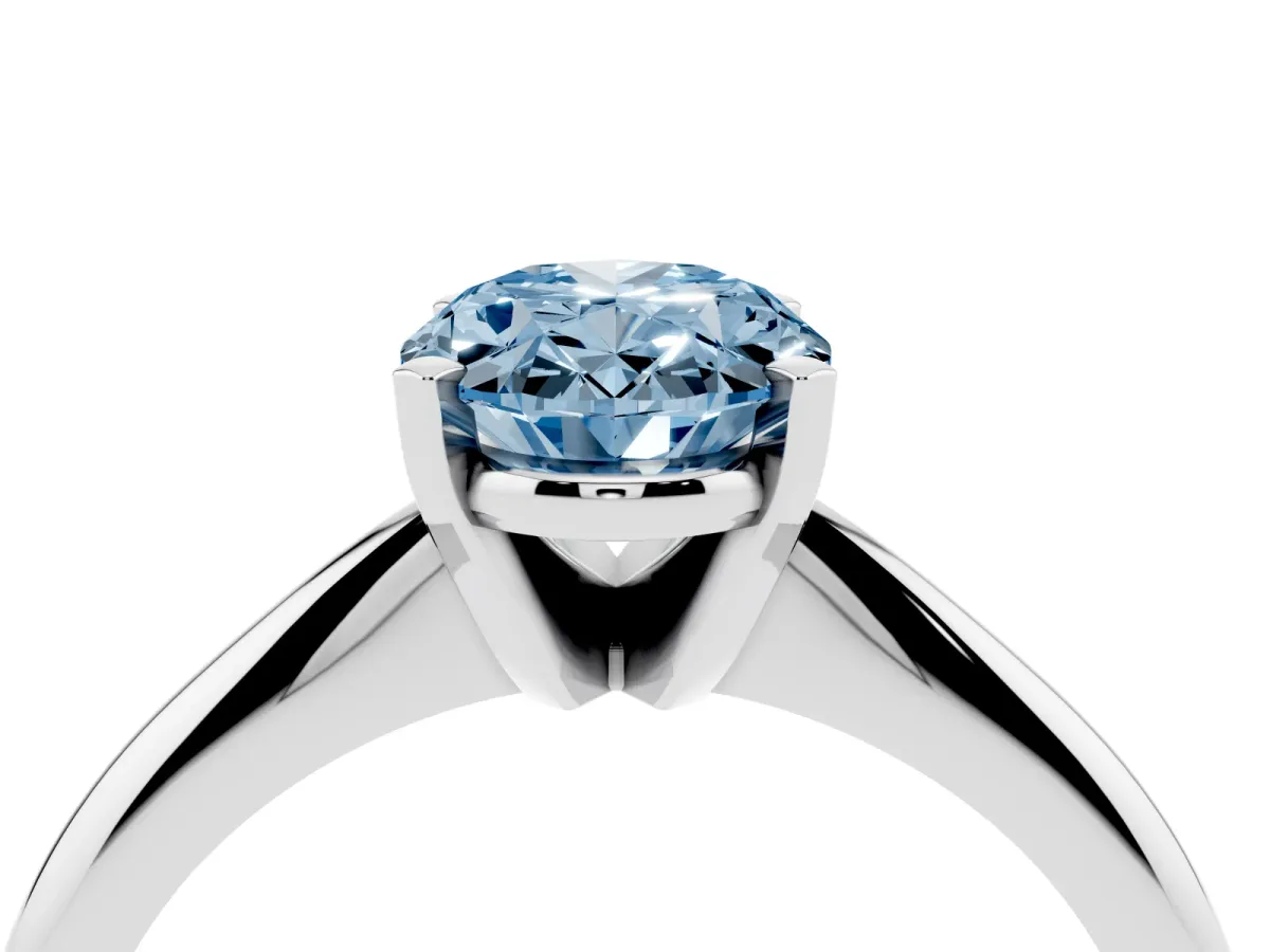 Fancy Blue Oval Cut Cut Solitaire Ring with Four-Prong Setting on a Classic Band Silver