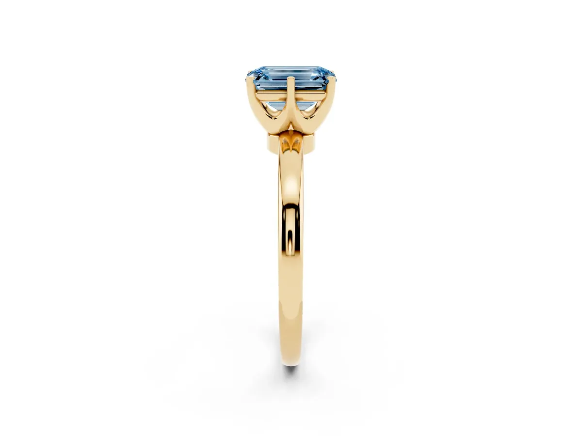 Fancy Blue Emerald Cut Solitaire Diamond Ring with Six-Prong Setting on a Classic Band Yellow gold