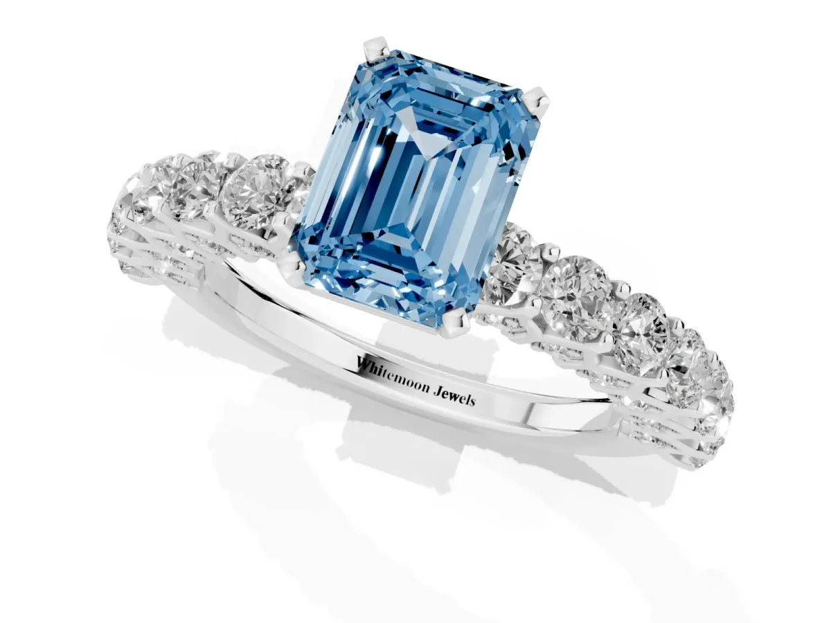 Fancy Blue Emerald Cut Diamond Solitaire Ring with Shared Prong Pavé Band and Four-Prong Setting Silver
