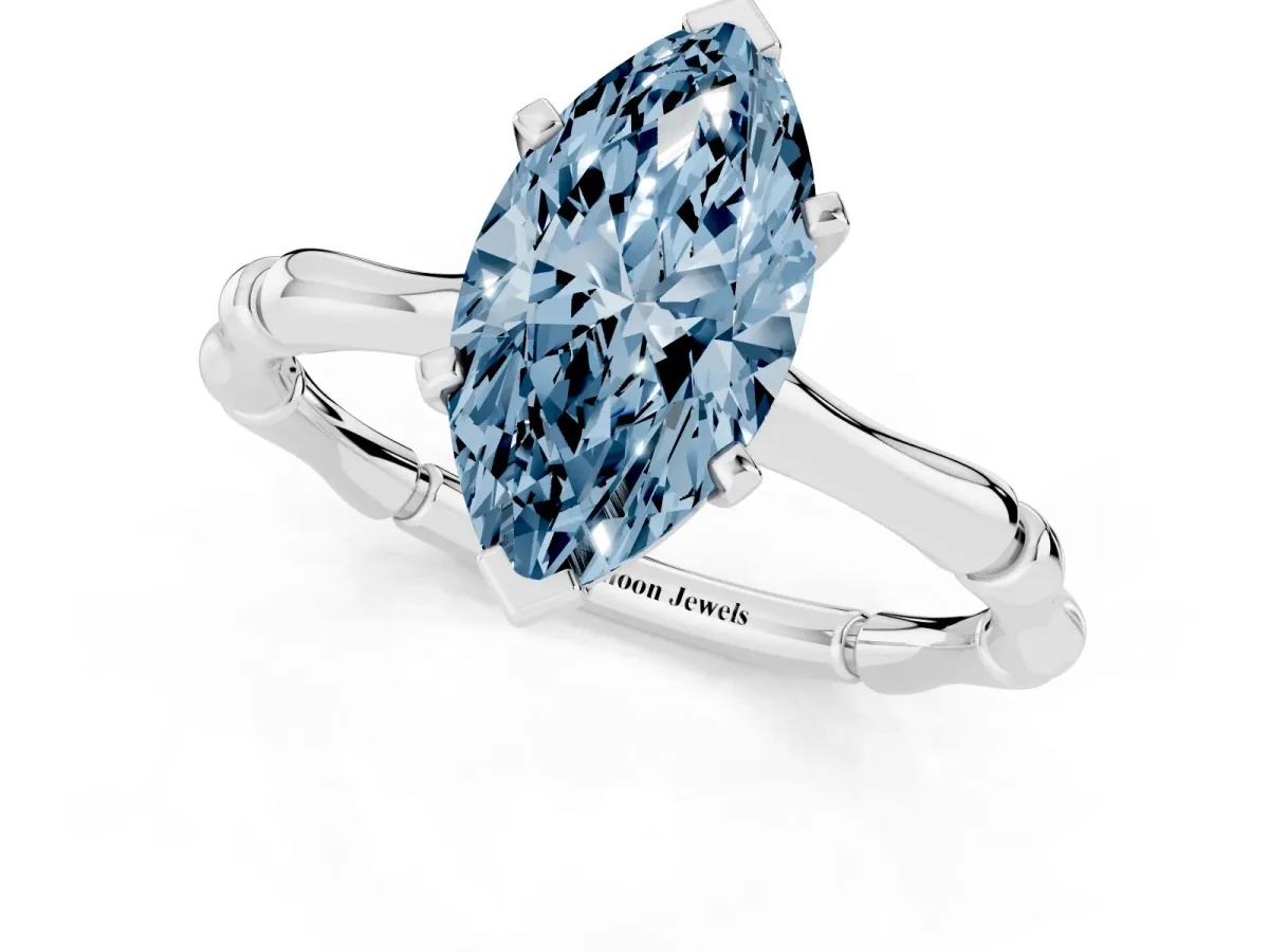 Fancy Blue Marquise Cut Solitaire Diamond Ring with Bamboo Band and Four-Prong Setting Silver