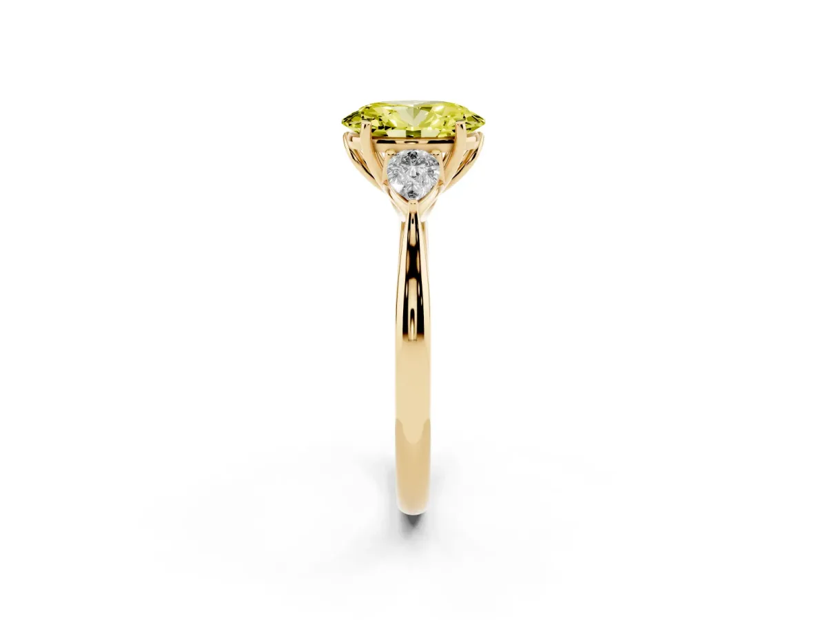 Fancy Yellow Three-Stone Oval Cut Diamond Ring with Pear Side Stones in Four-Prong Setting Yellow gold