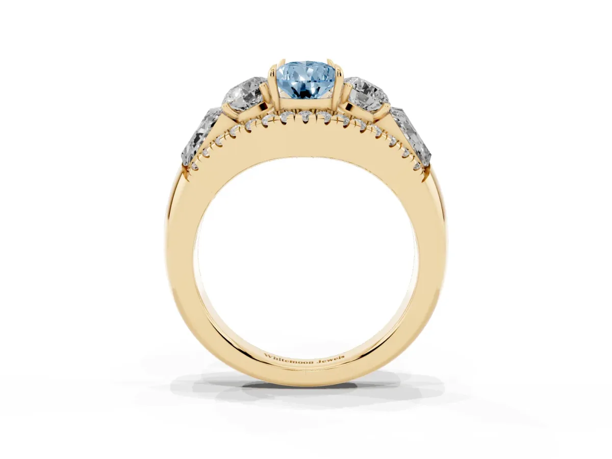 Fancy Blue Three-Stone Pear Cut Diamond Engagement Ring with Pave Band and Prong Setting Yellow gold