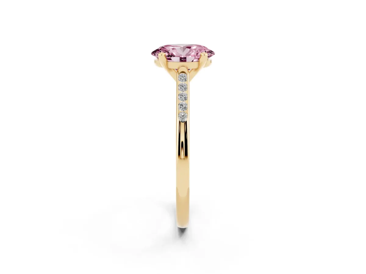 Fancy Pink Oval Cut Diamond Solitaire Ring with Channel Set Round Band and Prong Setting Yellow gold
