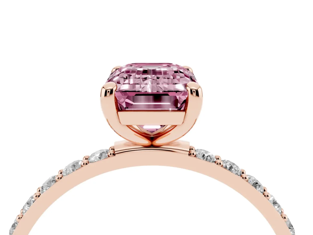 Fancy Pink Emerald Cut Diamond Solitaire Ring with Round Pavé Band and Prong Setting Rose gold