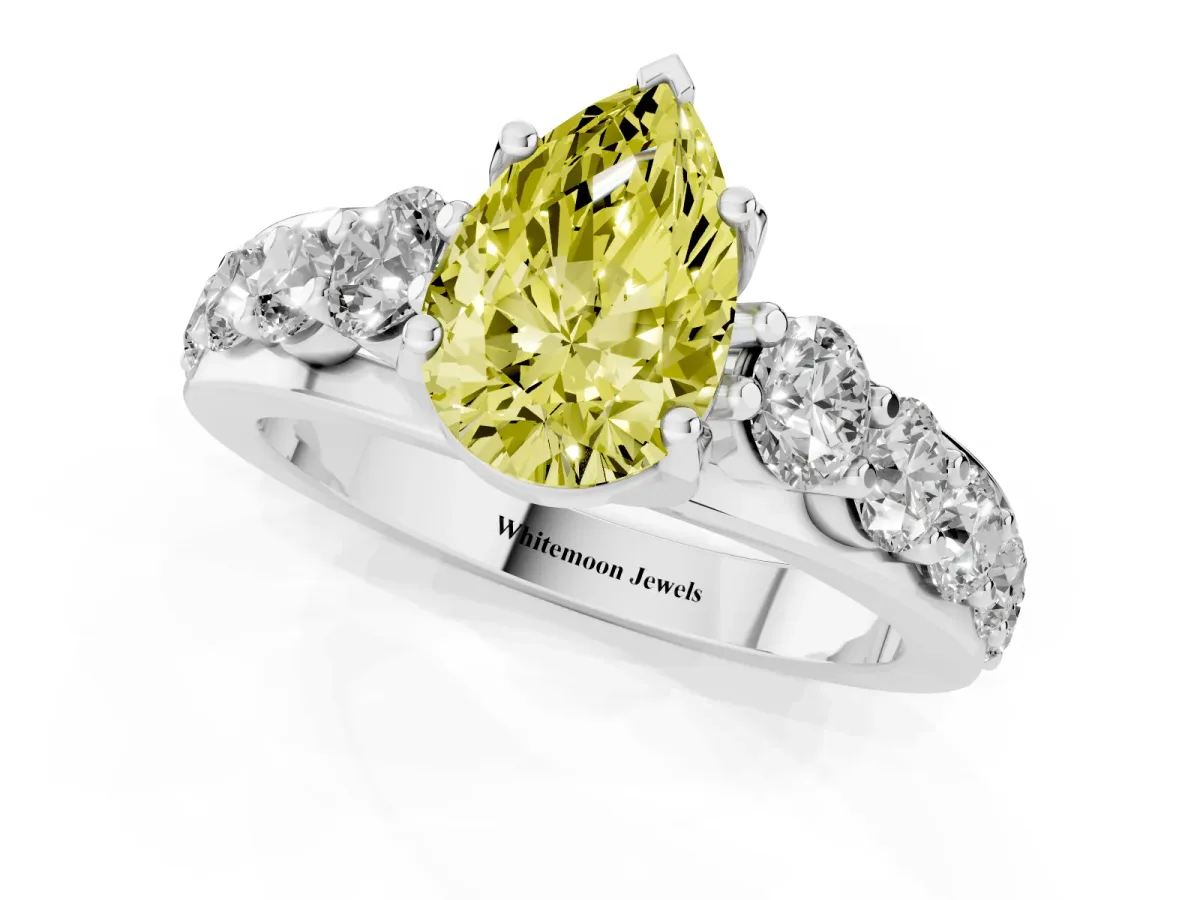 Fancy Yellow Pear Cut Diamond Engagement Ring with Pavé Band and Four-Prong Setting Silver