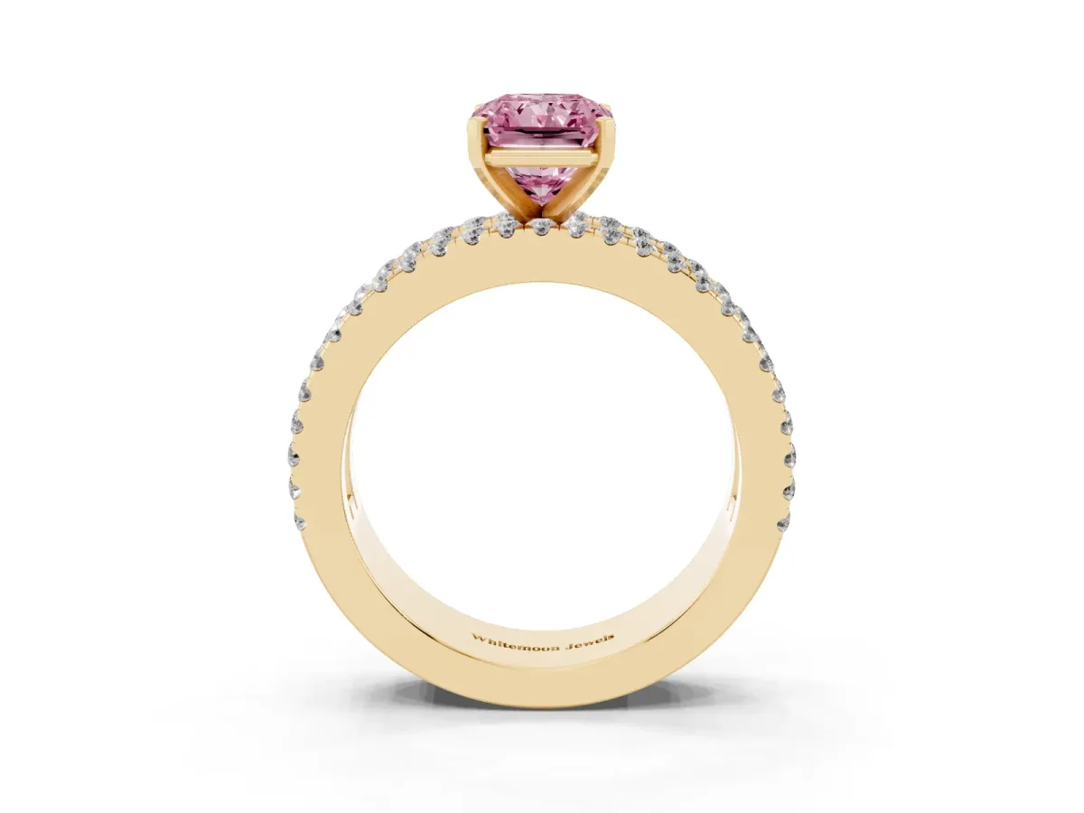 Fancy Pink Radiant Cut Diamond Solitaire Ring with Pavé and Channel Set Band Yellow gold