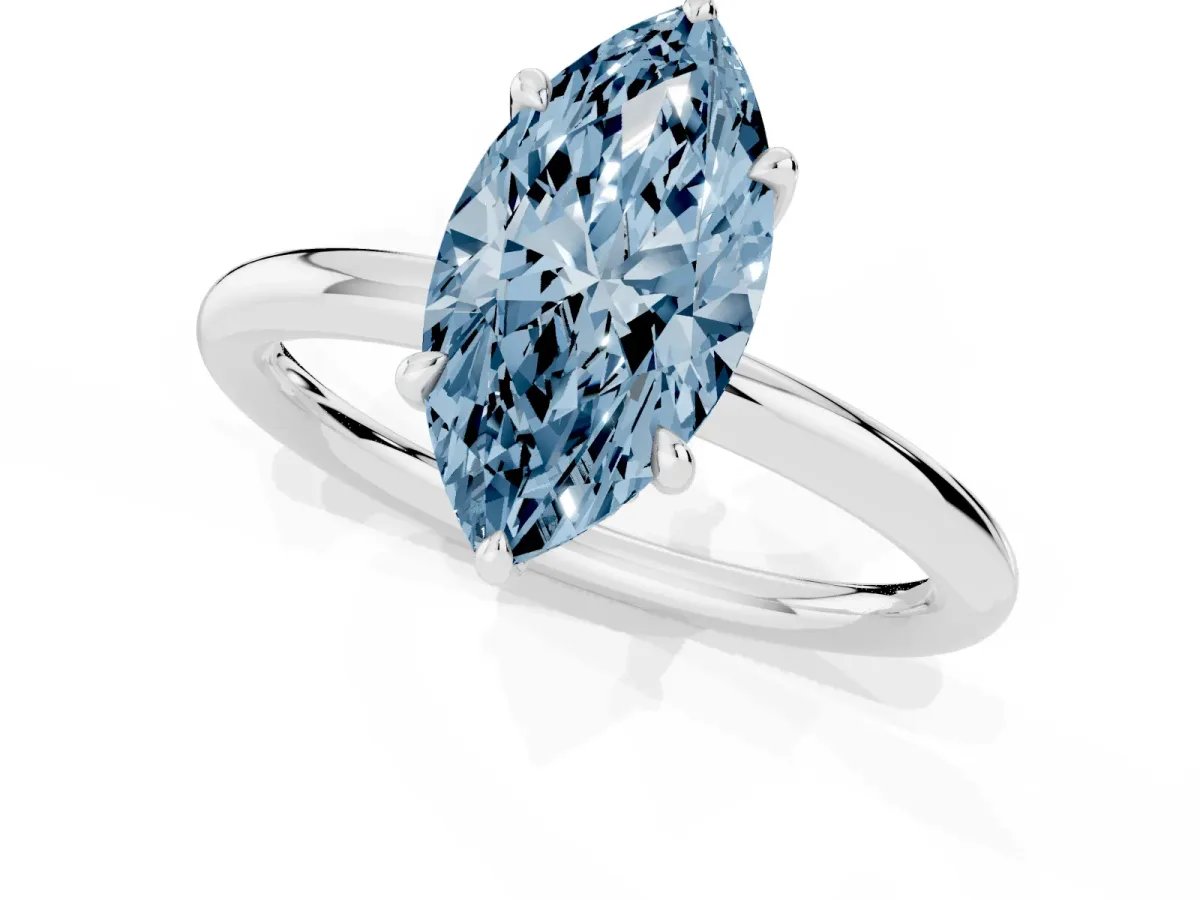 Fancy Blue Marquise Cut Diamond Solitaire Ring with Thin Band and Four-Prong Setting Silver