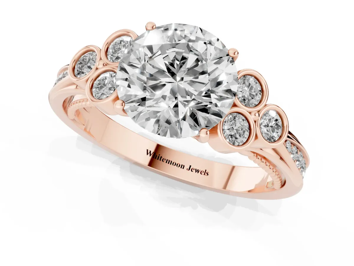 Round Cut Cut Diamond Engagement Ring with Bezel Set Round Side Stones and Prong Setting Rose gold