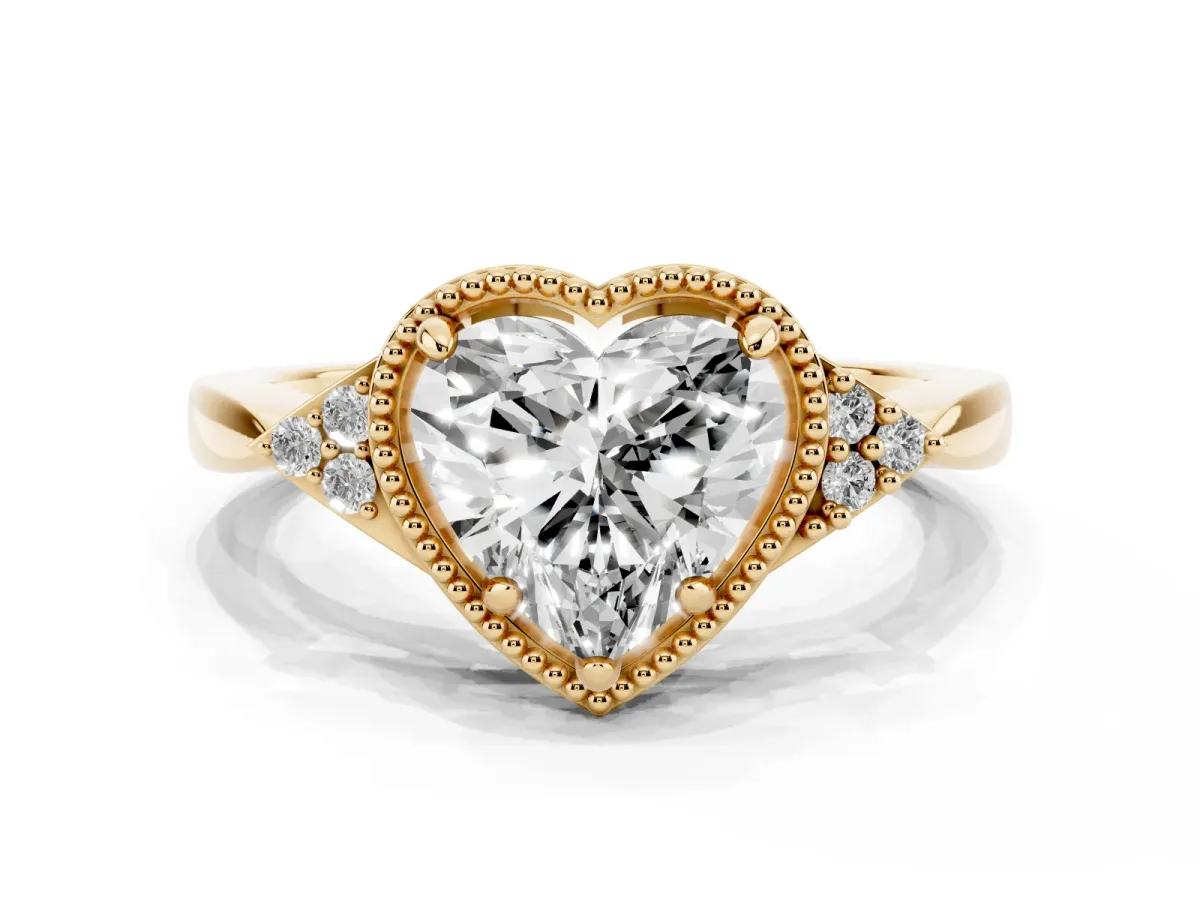 Milgrain Heart Cut Cut Diamond Ring with Tapered Pave Band and Four Prong Setting Yellow gold
