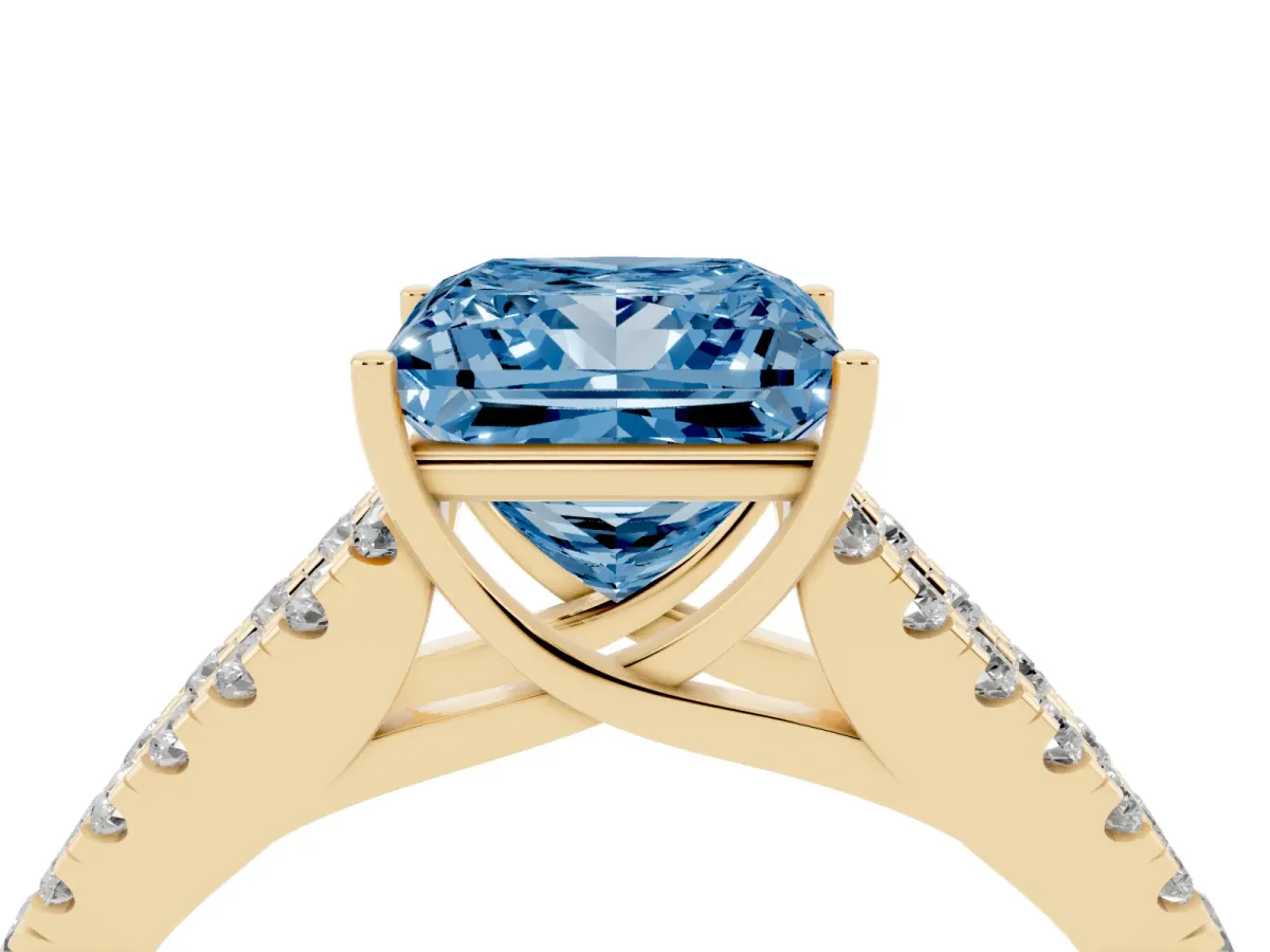 Fancy Blue Princess Cut Diamond Split Shank Pavé Engagement Ring with Four-Prong Setting Yellow gold
