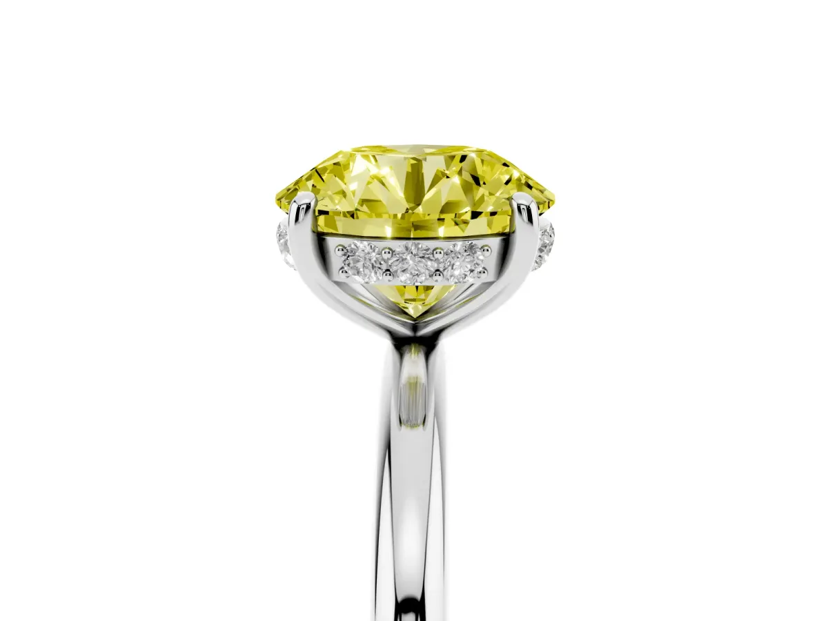 Fancy Yellow Round Cut Solitaire Diamond Ring with a Classic Band and Four-Prong Setting Silver