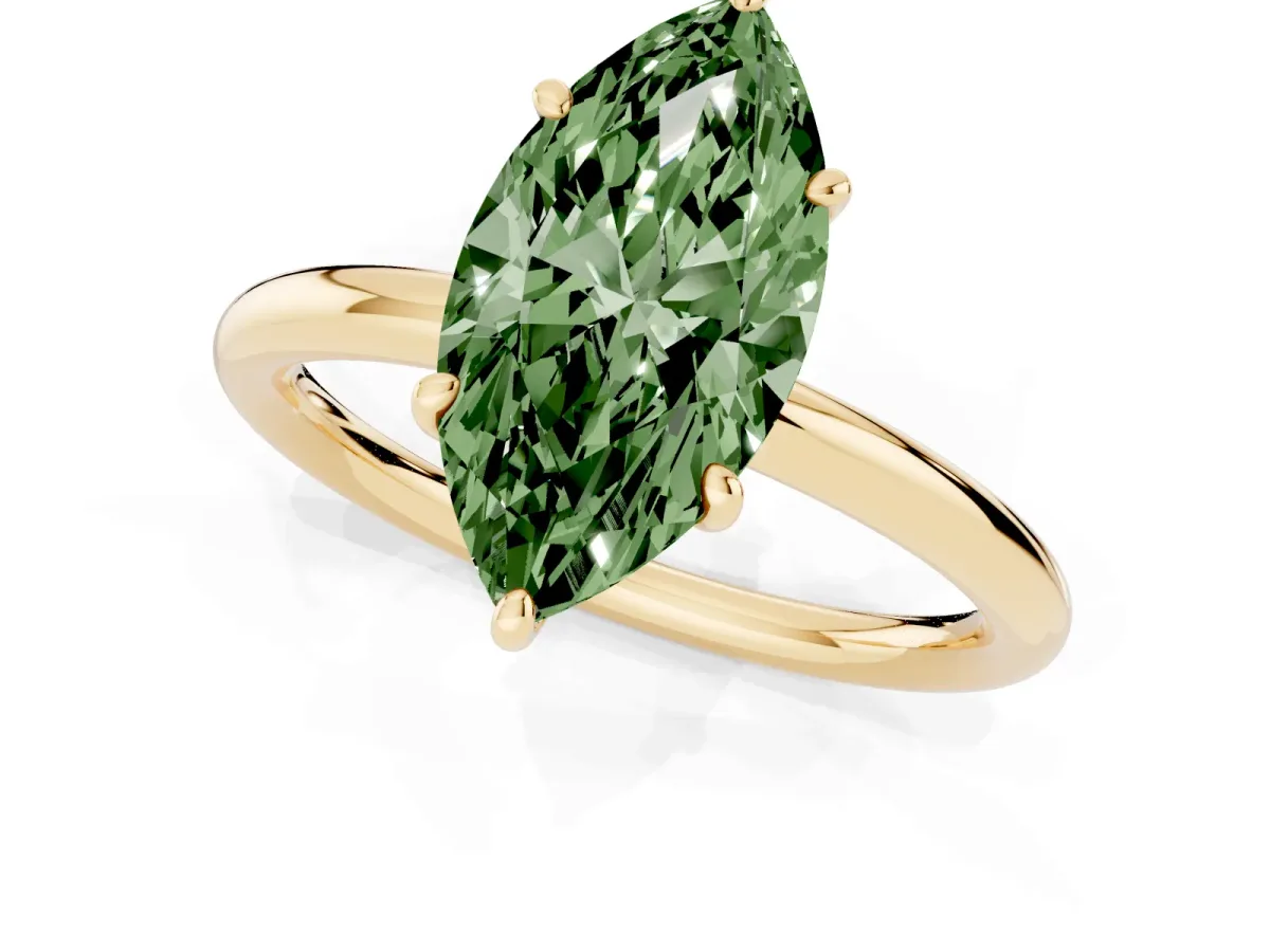 Fancy Green Oval Cut Solitaire Diamond Ring with Four-Prong Setting on a Plain Band Yellow gold