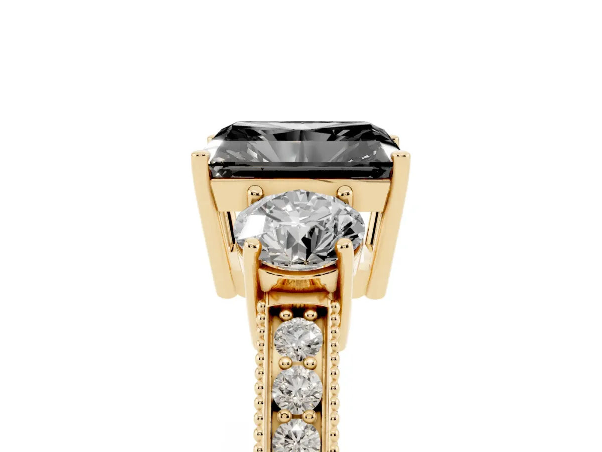 Fancy Black Radiant Cut Three-Stone Diamond Ring with Pavé Band and Four-Prong Setting Yellow gold