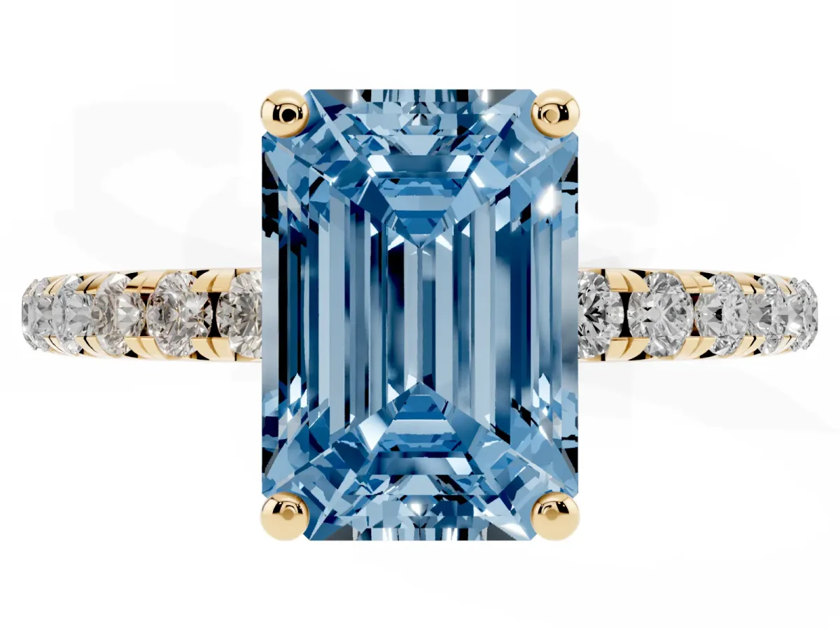 Fancy Blue Emerald Cut Cut Diamond Solitaire Ring with Micro Pave Band and Four Prong Setting Yellow gold