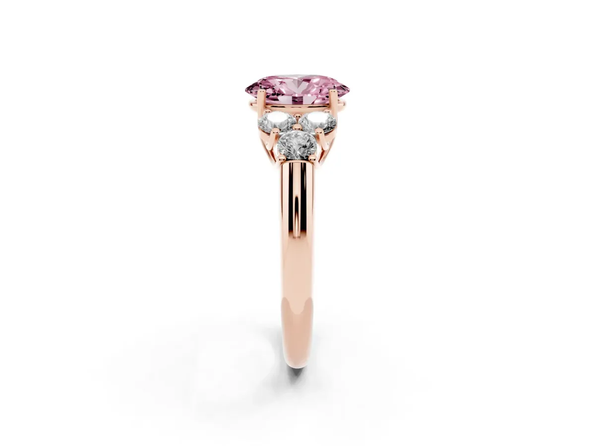 Fancy Pink Oval Cut Cut Diamond Cluster Ring with Round Accent Stones and Prong Setting on a Classic Band Rose gold