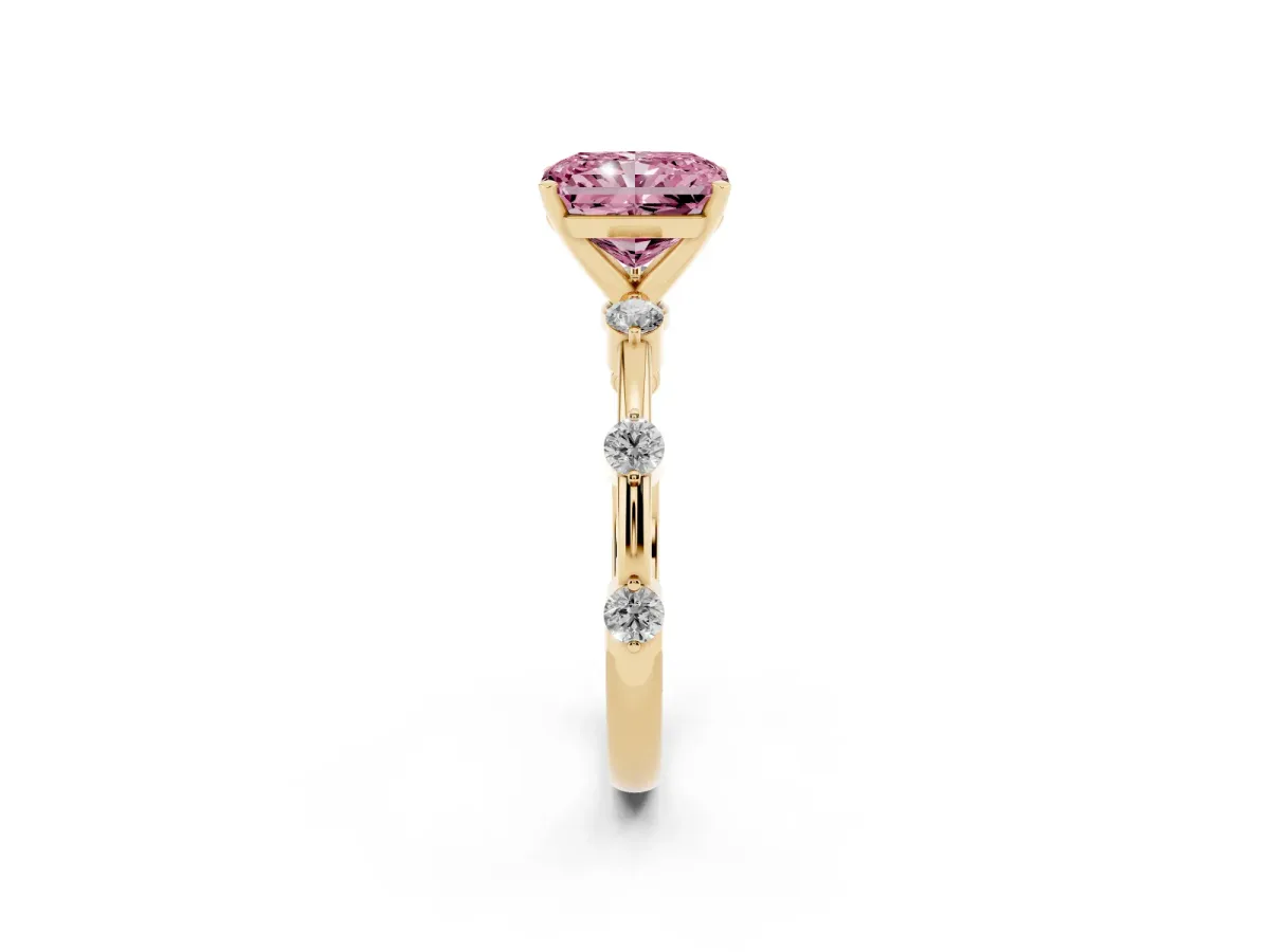 Fancy Pink Radiant Cut Solitaire Diamond Ring with Bezel Set Side Stones and Prong Setting Yellow gold