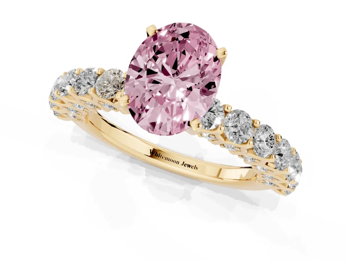 Fancy Pink Oval Cut Diamond Solitaire Ring with Shared Prong Pavé Band and Four-Prong Setting Yellow gold